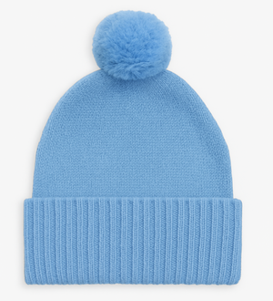 Blue knit beanie with a pom-pom on a white background