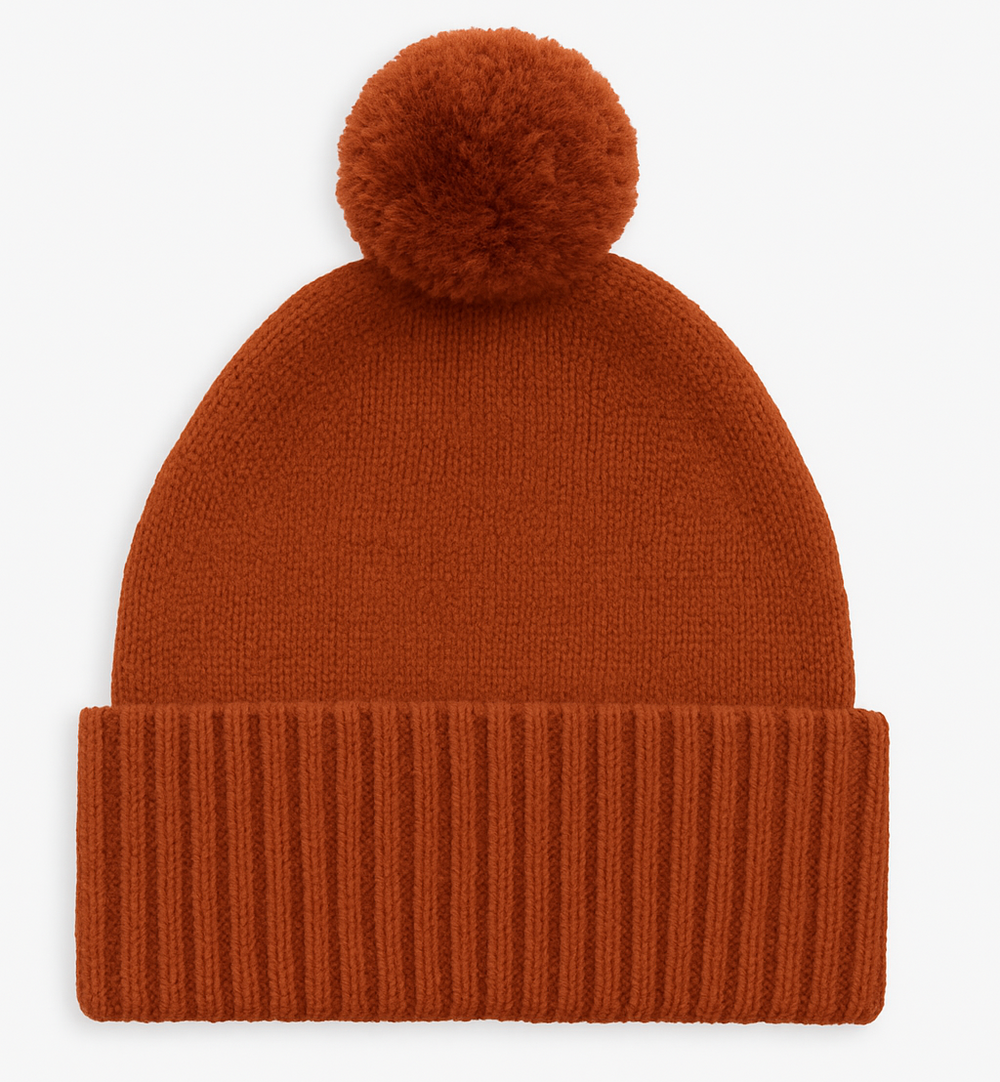 Brown knit beanie with a pom-pom on a white background