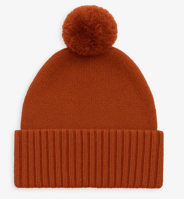 Brown knit beanie with a pom-pom on a white background